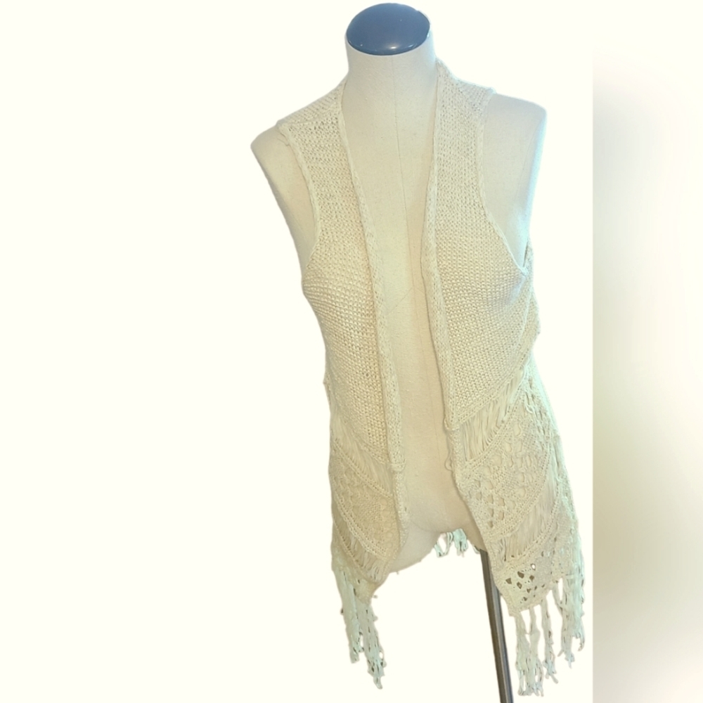 It's one time, Knitted off white cardigan. Fringes at bottom.